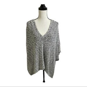 Aiko knit poncho with side buttons pull over. Black and white cable knit Small